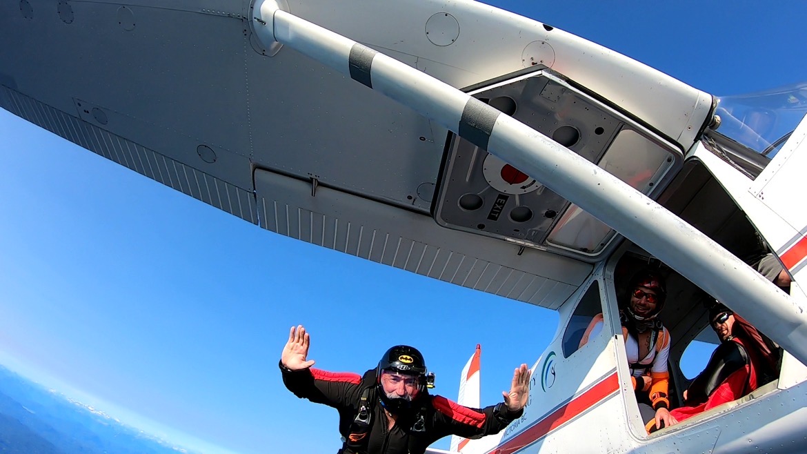Bob Verret the owner skydiving from a plane